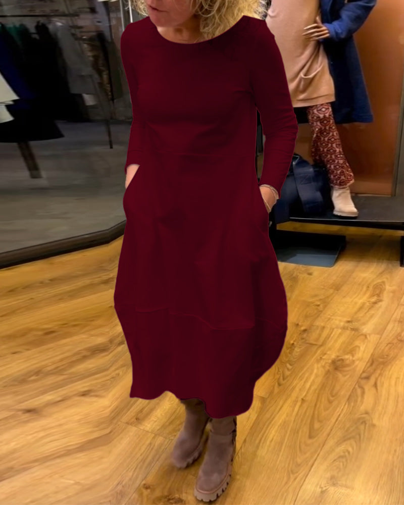 Schwarzes Midikleid mit Eva™-Taschen - Eleganz und Komfort in einem Design